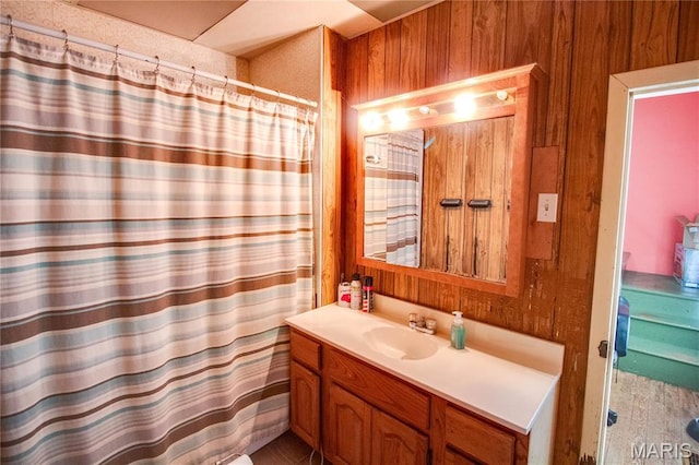 225 Tunison, White Hall, IL 62092 - bathroom featuring vanity, curtained shower, and wood walls