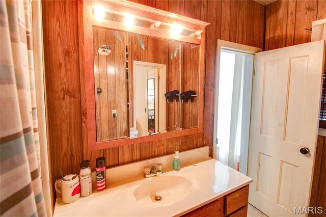 225 Tunison, White Hall, IL 62092 - bathroom featuring vanity and wooden walls