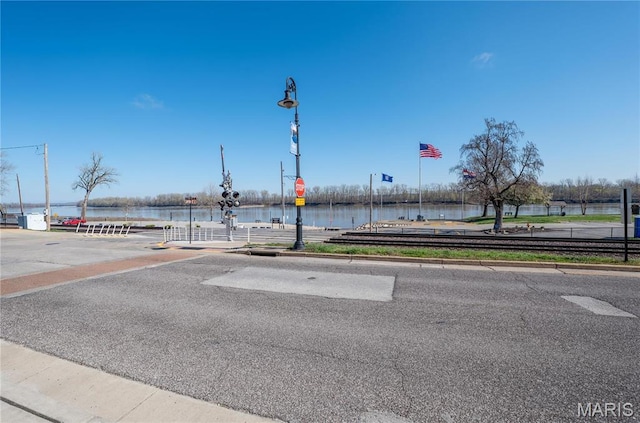4 Lafayette St, Washington, MO 63090 - view of asphalt road with curbs, a water view, and traffic signs
