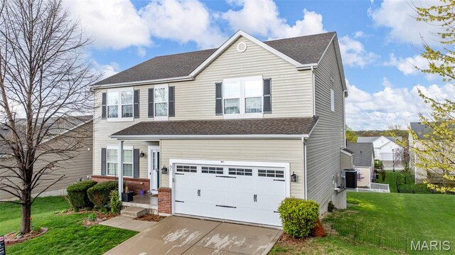 77 Brighton Park Dr, Saint Charles, MO 63303 - traditional home with a garage, central air condition unit, concrete driveway, a front lawn, and roof with shingles