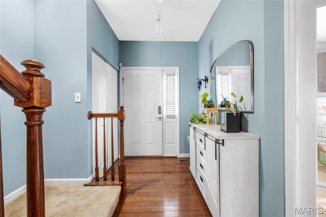 77 Brighton Park Dr, Saint Charles, MO 63303 - entrance foyer featuring dark wood-style floors and baseboards