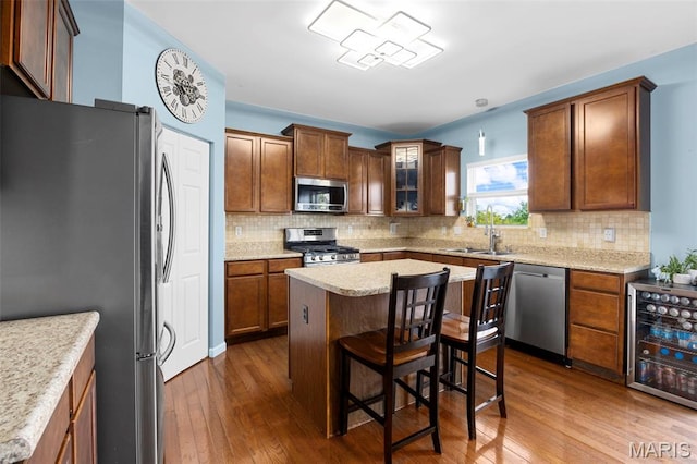 77 Brighton Park Dr, Saint Charles, MO 63303 - kitchen featuring stainless steel appliances, wine cooler, dark wood-style flooring, and backsplash