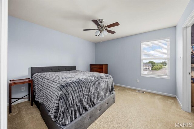 77 Brighton Park Dr, Saint Charles, MO 63303 - bedroom with carpet flooring, baseboards, and a ceiling fan