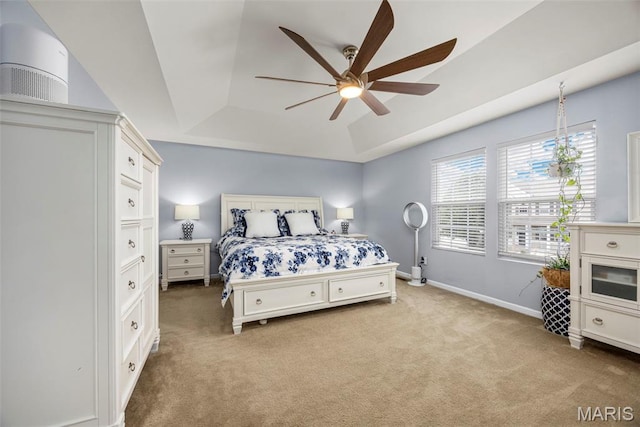 77 Brighton Park Dr, Saint Charles, MO 63303 - bedroom with carpet, baseboards, a tray ceiling, and a ceiling fan