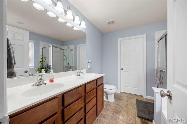 77 Brighton Park Dr, Saint Charles, MO 63303 - full bathroom with a stall shower, double vanity, toilet, and tile patterned flooring