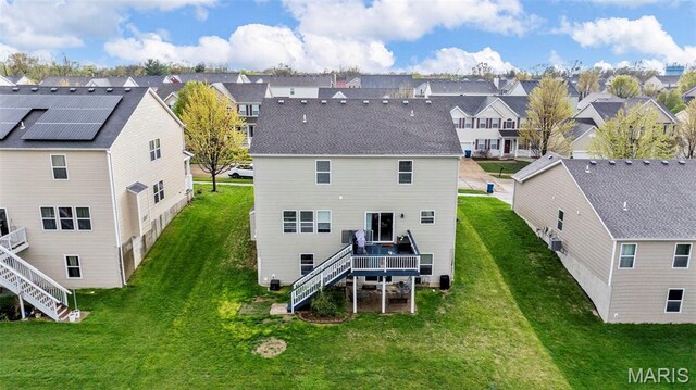 77 Brighton Park Dr, Saint Charles, MO 63303 - rear view of property with stairway, a residential view, a deck, and a lawn
