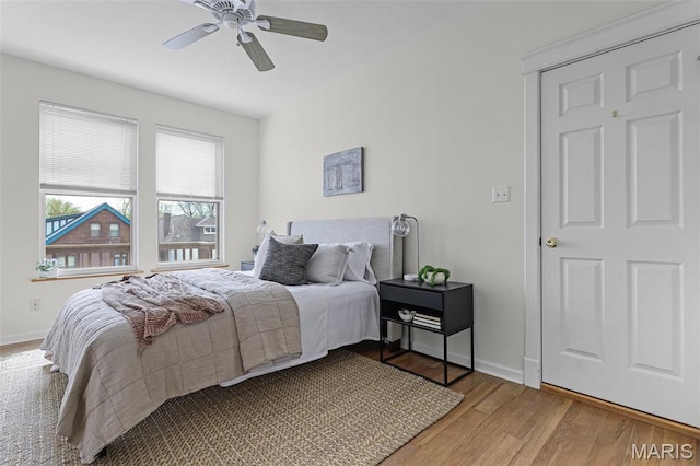 5858 Nina Pl Unit 3E, Saint Louis, MO 63112 - bedroom featuring wood finished floors, baseboards, and a ceiling fan