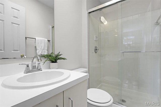 5858 Nina Pl Unit 3E, Saint Louis, MO 63112 - full bath featuring toilet, a stall shower, and vanity
