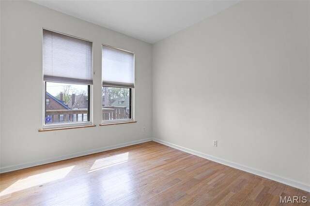 5858 Nina Pl Unit 3E, Saint Louis, MO 63112 - unfurnished room with light wood-type flooring and baseboards