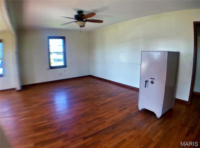 708 Locust St, Edgar Springs, MO 65462 - spare room featuring dark wood-style floors, a ceiling fan, and baseboards