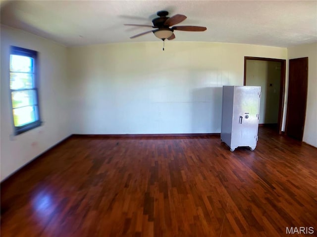 708 Locust St, Edgar Springs, MO 65462 - empty room with dark wood-type flooring, a ceiling fan, and baseboards