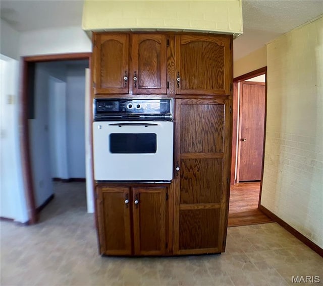 708 Locust St, Edgar Springs, MO 65462 - kitchen with white oven and baseboards