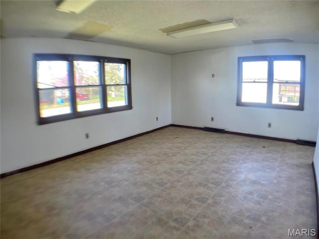 708 Locust St, Edgar Springs, MO 65462 - spare room featuring a textured ceiling and baseboards