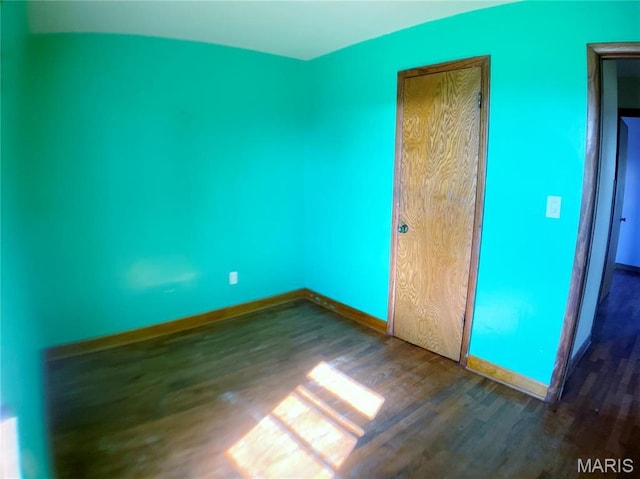 708 Locust St, Edgar Springs, MO 65462 - unfurnished bedroom featuring wood finished floors and baseboards