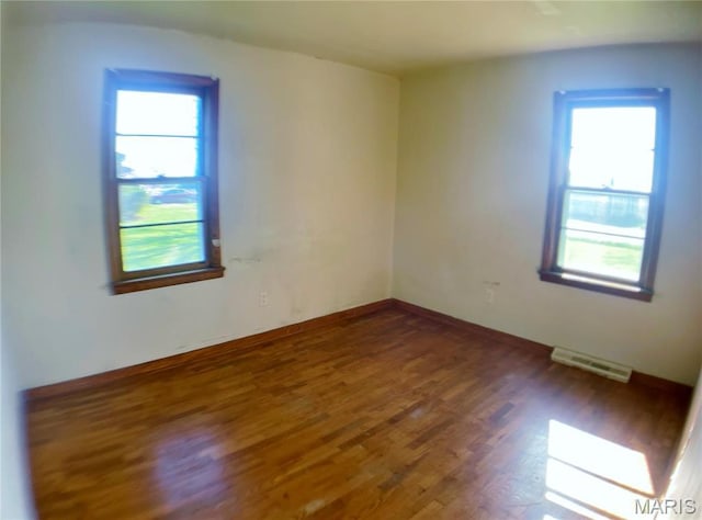 708 Locust St, Edgar Springs, MO 65462 - spare room featuring wood finished floors, healthy amount of natural light, and baseboards