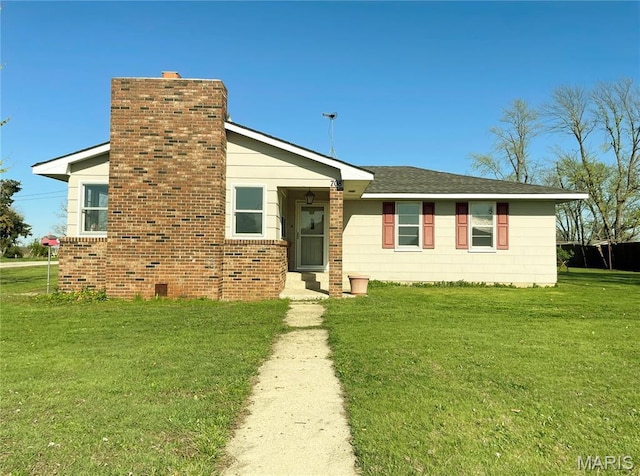708 Locust St, Edgar Springs, MO 65462 - view of front of house featuring a front lawn and a chimney