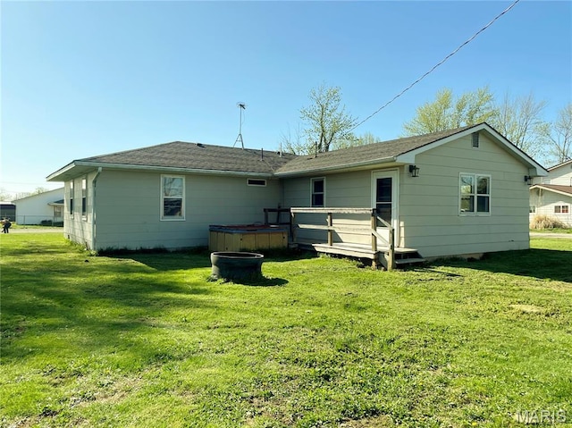 708 Locust St, Edgar Springs, MO 65462 - rear view of property with a hot tub, a deck, a lawn, and a shingled roof