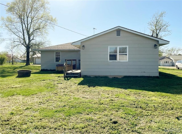 708 Locust St, Edgar Springs, MO 65462 - rear view of house featuring a lawn and a wooden deck