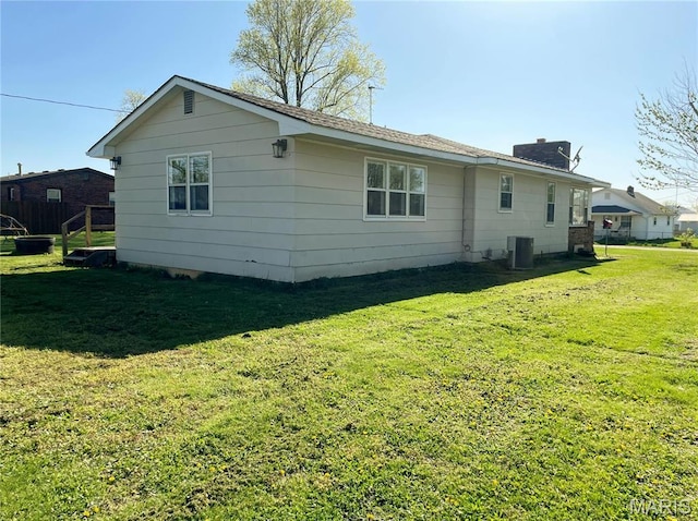 708 Locust St, Edgar Springs, MO 65462 - view of side of home featuring cooling unit, a yard, and a chimney