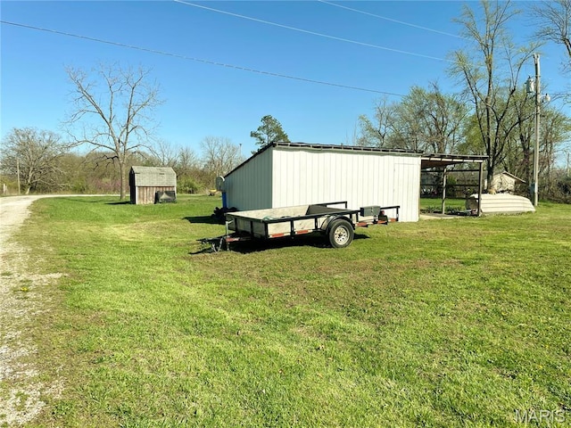 708 Locust St, Edgar Springs, MO 65462 - view of grassy yard with an outbuilding and a storage shed