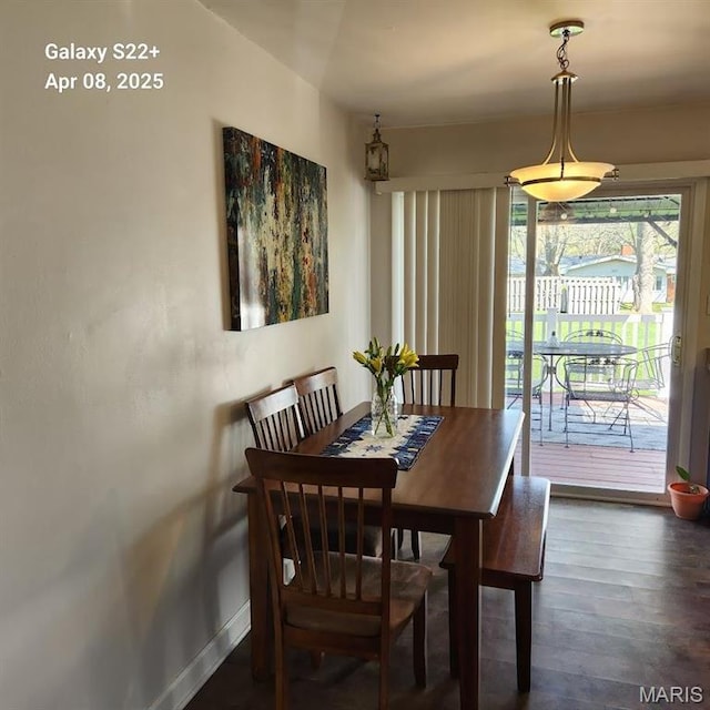 2011 Cypress St, Highland, IL 62249 - dining area featuring dark wood-style flooring and baseboards