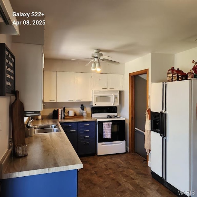 2011 Cypress St, Highland, IL 62249 - kitchen featuring white appliances, white cabinetry, blue cabinets, and a ceiling fan