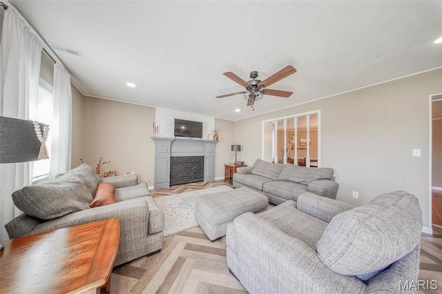 15227 County Road 1110, St James, MO 65559 - living area with a ceiling fan, baseboards, a fireplace, recessed lighting, and ornamental molding