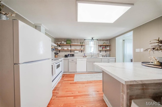 15227 County Road 1110, St James, MO 65559 - kitchen featuring white appliances, open shelves, light wood finished floors, and light countertops