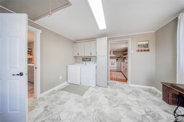 15227 County Road 1110, St James, MO 65559 - laundry area with cabinet space, washer and clothes dryer, light marble finish floors, crown molding, and baseboards