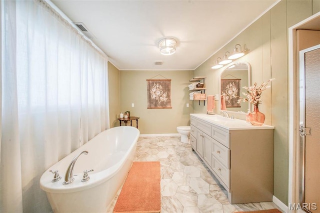 15227 County Road 1110, St James, MO 65559 - bathroom with a freestanding tub, vanity, toilet, ornamental molding, and baseboards