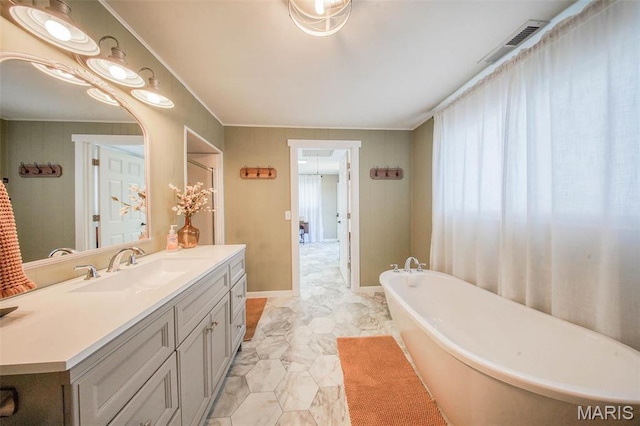 15227 County Road 1110, St James, MO 65559 - bathroom featuring vanity, a freestanding bath, baseboards, and marble finish floors