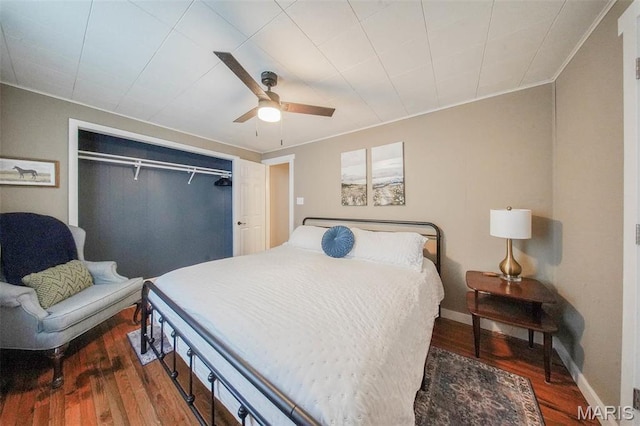 15227 County Road 1110, St James, MO 65559 - bedroom with wood finished floors, baseboards, ceiling fan, a closet, and crown molding