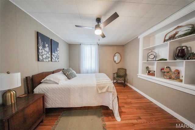 15227 County Road 1110, St James, MO 65559 - bedroom featuring wood finished floors, baseboards, and ceiling fan