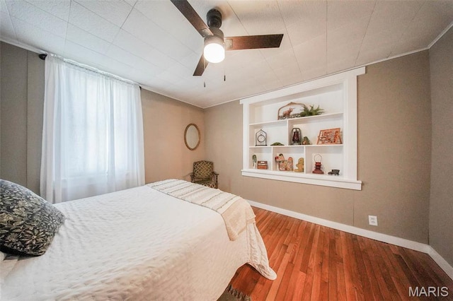15227 County Road 1110, St James, MO 65559 - bedroom with baseboards, wood finished floors, and a ceiling fan