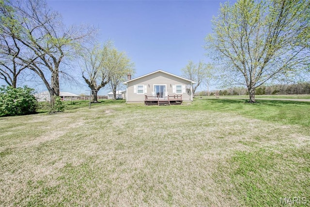 15227 County Road 1110, St James, MO 65559 - view of front of house featuring a wooden deck, a front yard, and a chimney