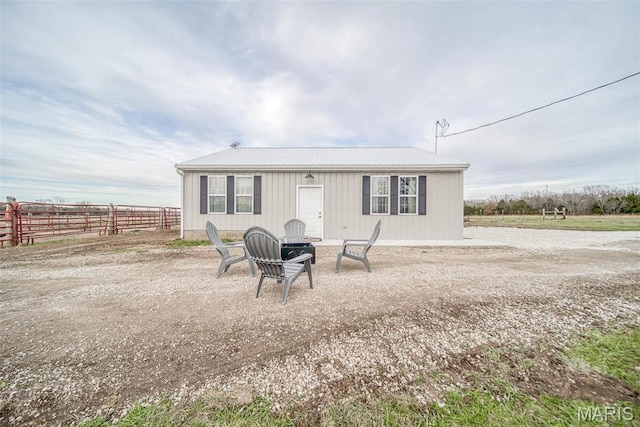 15227 County Road 1110, St James, MO 65559 - back of house featuring fence and metal roof