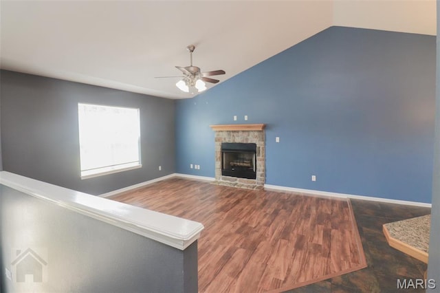 23332 Righteous Ln, Waynesville, MO 65583 - unfurnished living room with a ceiling fan, lofted ceiling, a fireplace, and wood finished floors