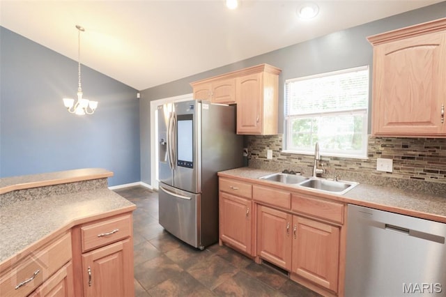 23332 Righteous Ln, Waynesville, MO 65583 - kitchen with stainless steel appliances, light brown cabinetry, lofted ceiling, decorative backsplash, and pendant lighting