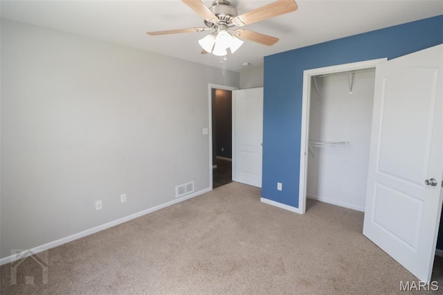 23332 Righteous Ln, Waynesville, MO 65583 - unfurnished bedroom with carpet floors, a closet, and a ceiling fan