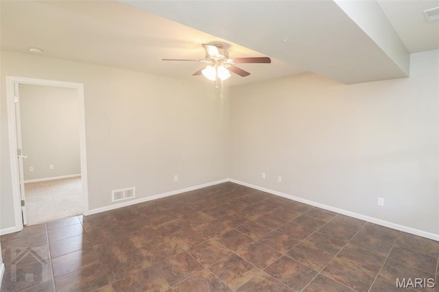 23332 Righteous Ln, Waynesville, MO 65583 - empty room featuring ceiling fan and dark tile patterned floors