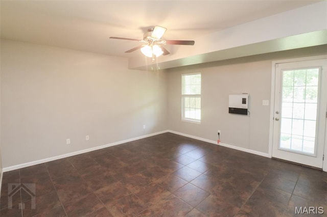23332 Righteous Ln, Waynesville, MO 65583 - spare room featuring ceiling fan and dark tile patterned flooring
