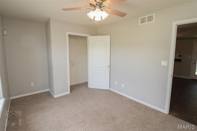 23332 Righteous Ln, Waynesville, MO 65583 - unfurnished bedroom with carpet flooring, a spacious closet, and a ceiling fan
