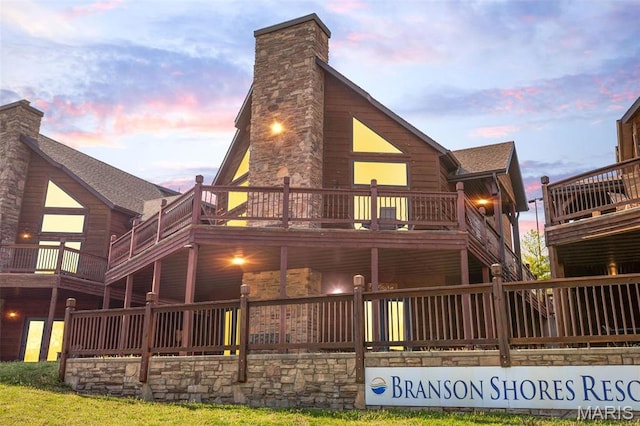 1318 Stormy Point Rd Unit 7, Branson, MO 65616 - rear view of property with a chimney, stone siding, and a shingled roof