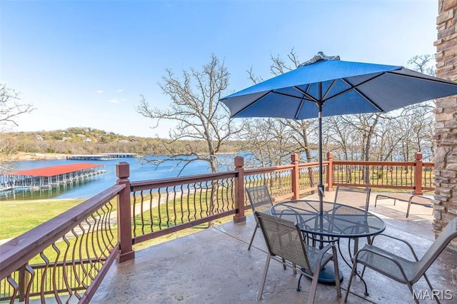 1318 Stormy Point Rd Unit 7, Branson, MO 65616 - view of patio featuring a water view and outdoor dining space