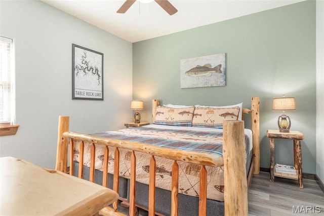 1318 Stormy Point Rd Unit 7, Branson, MO 65616 - bedroom featuring wood finished floors and a ceiling fan