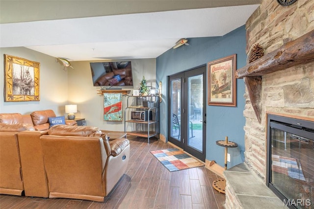 1318 Stormy Point Rd Unit 7, Branson, MO 65616 - living room with dark wood-style floors, french doors, and a stone fireplace