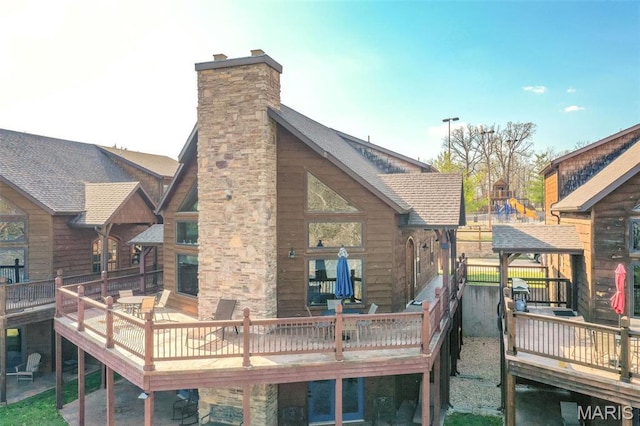 1318 Stormy Point Rd Unit 7, Branson, MO 65616 - rear view of property with a deck, a chimney, and a shingled roof