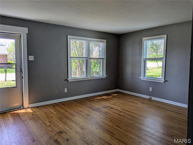 330 N Floridale Ave, Saint Louis, MO 63135 - empty room featuring wood finished floors and baseboards