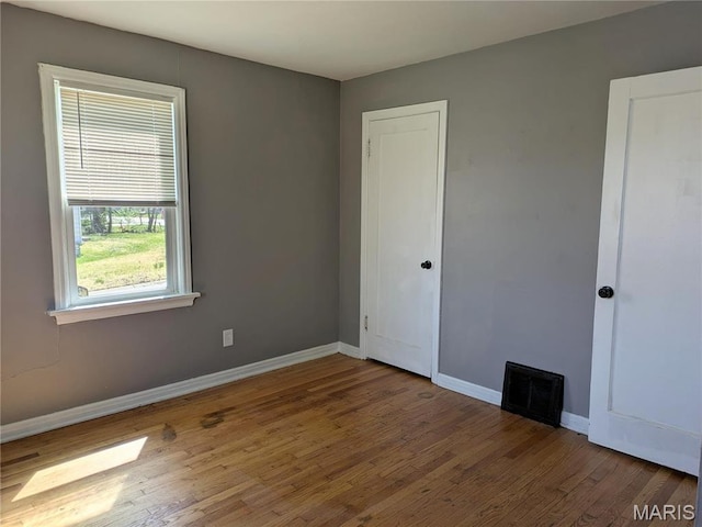 330 N Floridale Ave, Saint Louis, MO 63135 - empty room featuring wood finished floors and baseboards