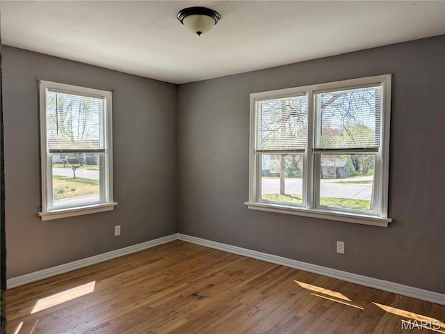 330 N Floridale Ave, Saint Louis, MO 63135 - unfurnished room featuring baseboards and wood finished floors
